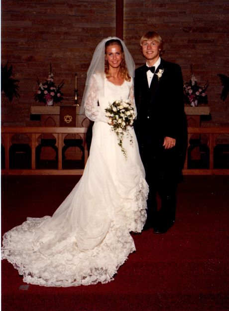 a bride and groom posing for a photo in front of the alter at their wedding