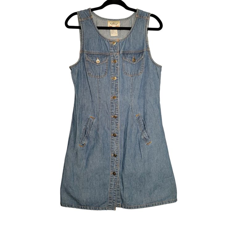 This vintage 90's denim mini dress from Tickets Clothing is a women's size M/8. With a button-up design, sleeveless style, and functional pockets, it's a classic throwback to a stylish era. Made from 100% cotton in a striking blue. * Vintage 90's design * Women's size M/8 * Button-up style * Sleeveless mini dress * Functional pockets * Made from 100% cotton * Blue color * Brand: Tickets Clothing Size: Medium/8 Measurements: Pit to pit 18 in / 46 cm Waist(across, laying flat) 16.5 in / 42 cm Length 36 in / 91 cm Across Hem 22 in / 56 cm Excellent pre-owned condition, wear to the buttons no other flaws  Sold as Pictured. Thanks for viewing! Questions welcome! Vintage Denim Vest With Buttons, Vintage Sleeveless Denim Dress With Pockets, Retro Sleeveless Denim Vest For Summer, Retro Sleeveless Denim Dress For Spring, Sleeveless Vintage Denim Dress With Pockets, Retro Sleeveless Cotton Denim Dress, Vintage Denim Vest With Buttons For Summer, Retro Sleeveless Denim Dress, Vintage Sleeveless Denim Dress