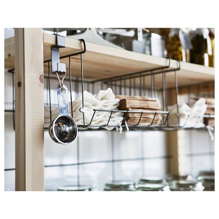 the kitchen shelves are organized with utensils and other things to cook in them