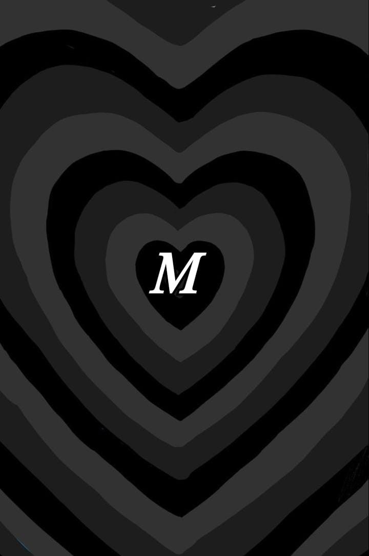 a black heart with the letter m on it