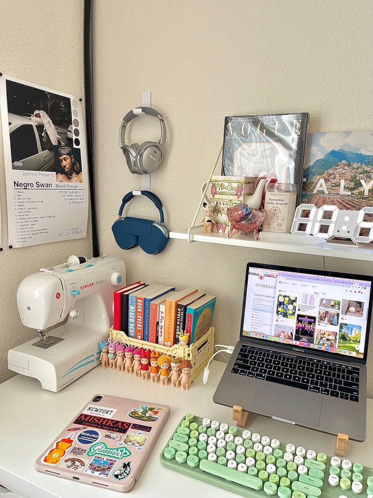 a laptop computer sitting on top of a white desk