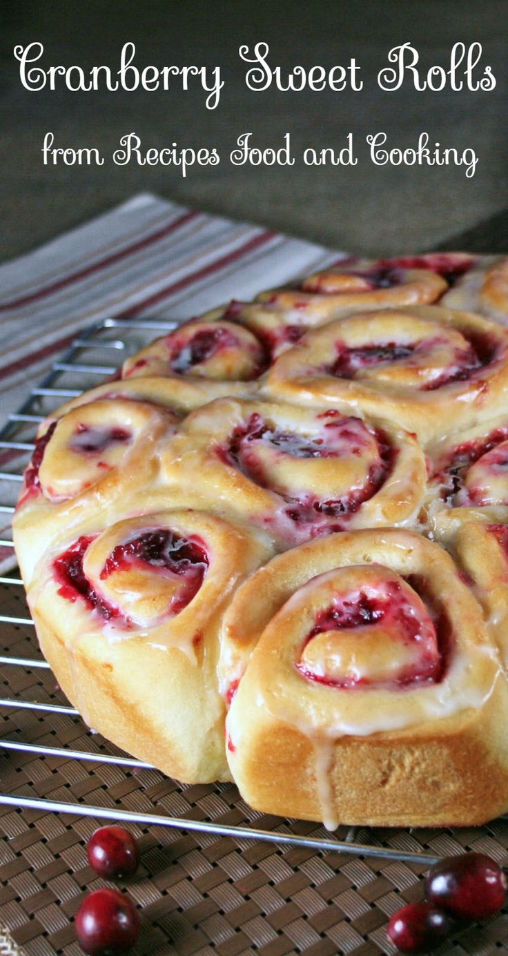 cranberry sweet rolls on a cooling rack