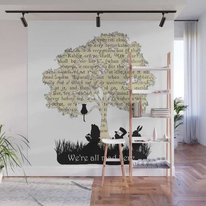 there is a wall mural in the living room with an animal and tree on it