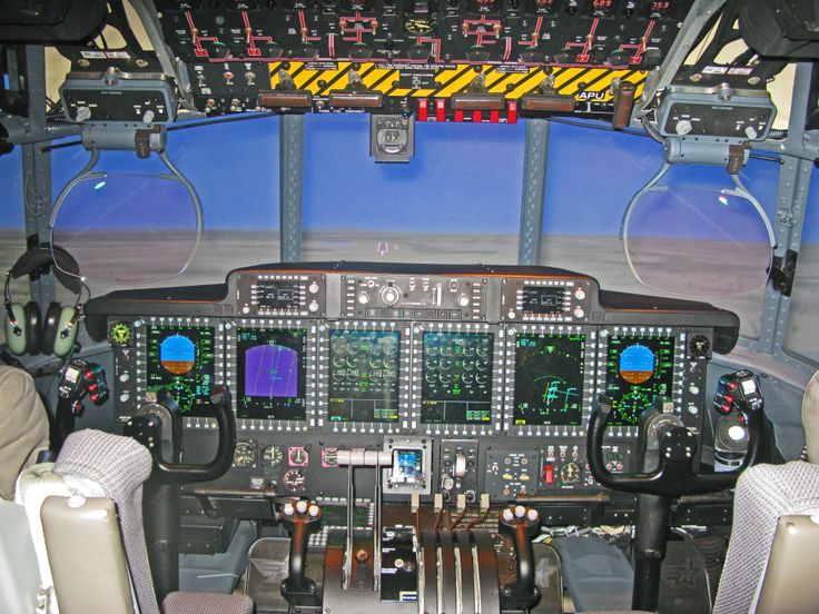 the cockpit of an airplane with two pilots