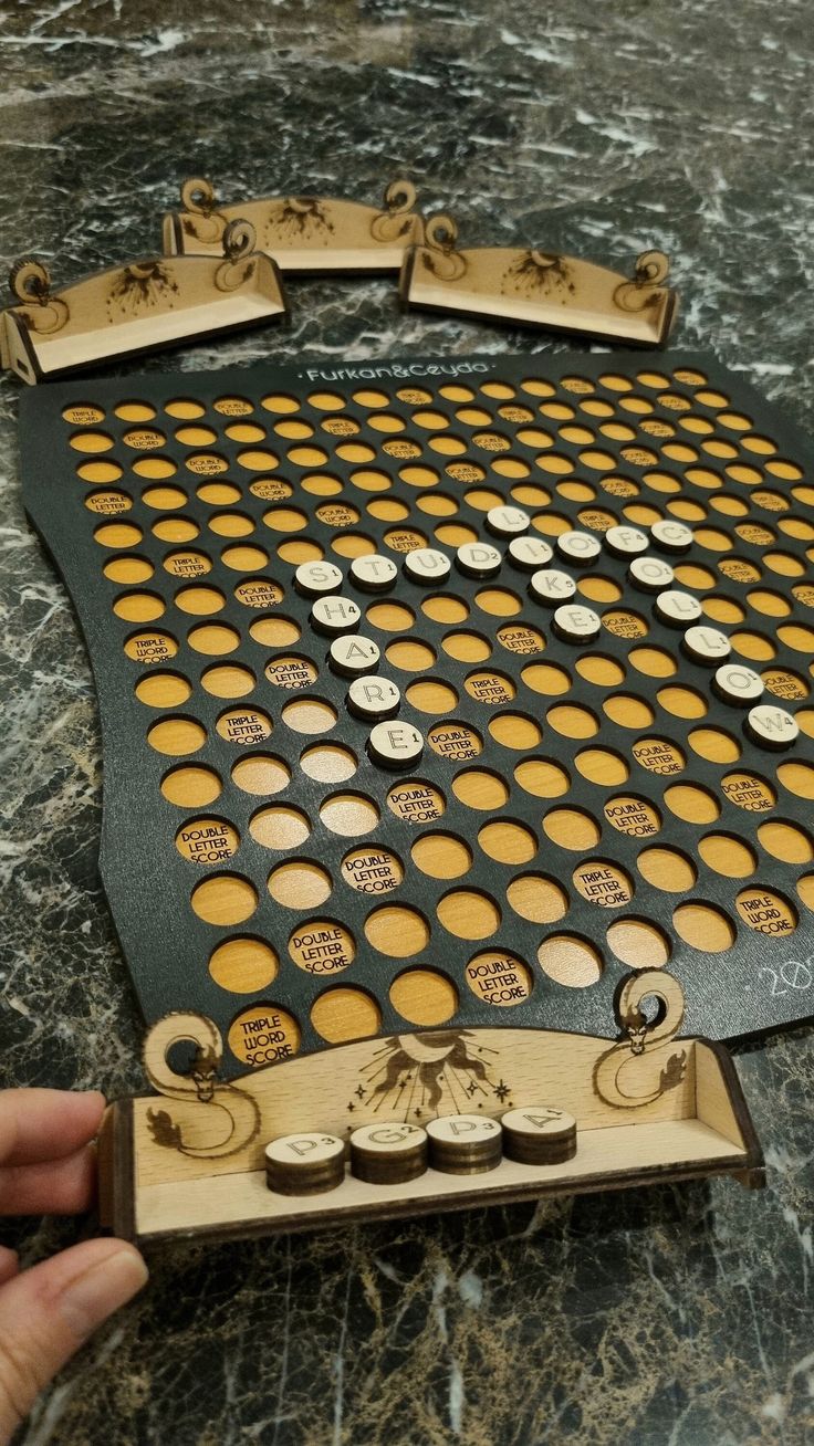 a game board sitting on top of a table with lots of holes in the middle