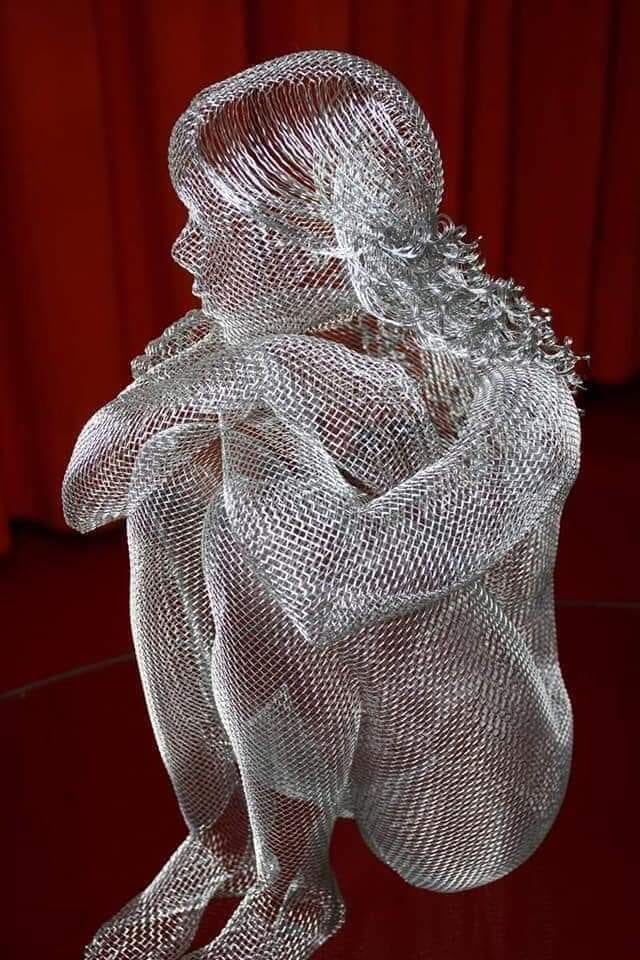 a white sculpture sitting on top of a table