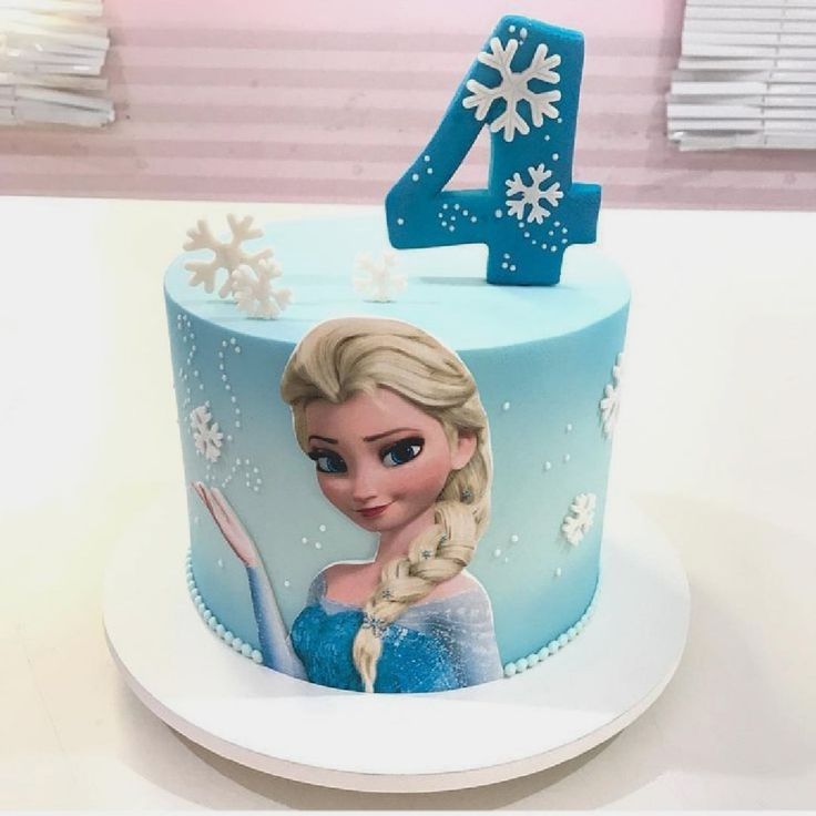 a frozen princess cake with the number four on it