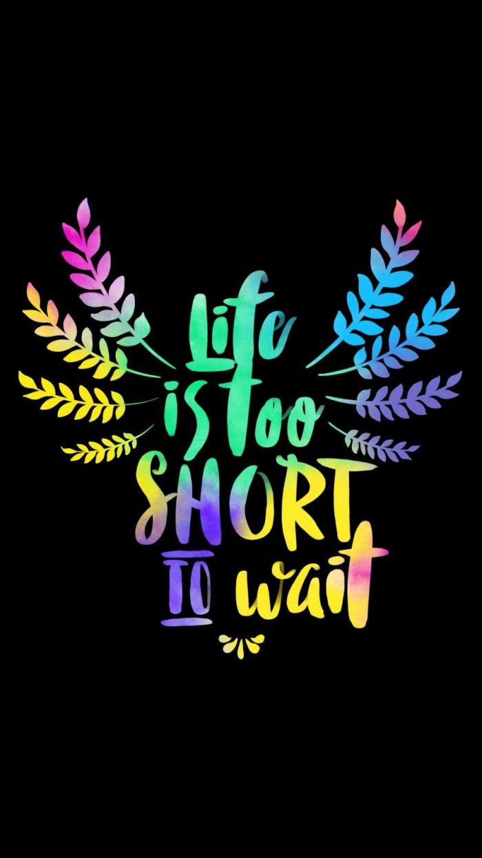 the words life is too short to wait are painted in bright colors on a black background