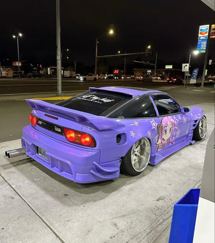 a purple modified car parked in a parking lot