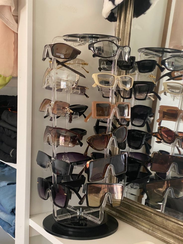 there are many pairs of sunglasses on display