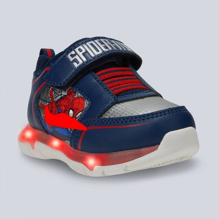 With the Marvel Toddler Spider-Man Athletic Sneakers in Navy Blue and Red, your little one can embark on endless adventures all day. Designed with a round and closed-toe design, these sneakers are designed with your kid's comfort and protection in mind. The adjustable hook and loop strap ensures a secure fit, while the polyester insole material offers cushioning support. Lined with polyester, these sneakers are durable and easy on the feet for prolonged wear. Marvel Shoes, Boys Winter Boots, Velcro Sneakers, Light Up Shoes, Mens Winter Boots, Toddler Sneakers, Closed Toe Shoes, Swim Shoes, Rubber Shoes