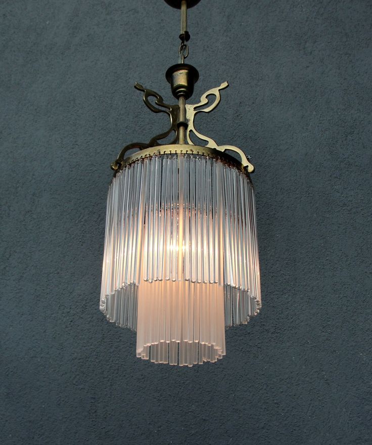 a chandelier hanging from the ceiling with a light bulb on it's side