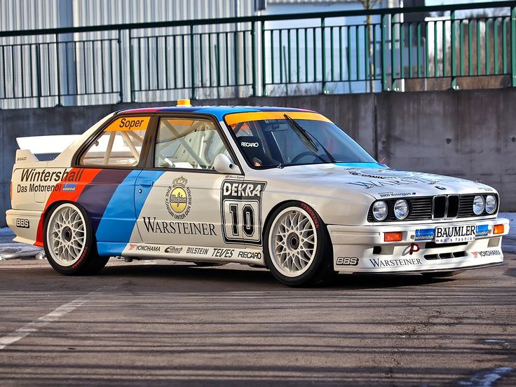 a bmw race car parked in a parking lot