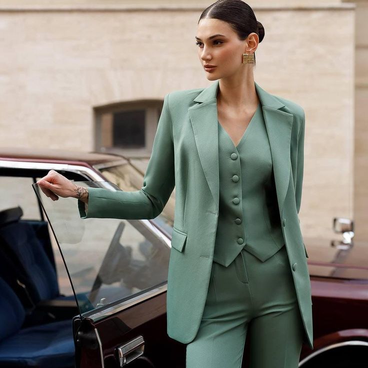 This elegant sage green three-piece suit is the epitome of modern sophistication, perfect for the professional woman who values both style and functionality. The tailored blazer, chic vest, and straight-leg trousers create a sharp, polished look ideal for the office, business meetings, or formal events. 🌿 Classic blazer: Tailored fit with sharp lapels and structured shoulders for a refined, professional look. 👗 Chic vest: Adds a stylish layer, creating a sleek silhouette while offering versatility for various occasions. 👖 Flattering trousers: Straight-leg design that elongates the figure, offering a comfortable yet elegant fit. ✨ High-quality fabric: Crafted from premium materials, ensuring comfort, durability, and a sleek finish. 🎉 Versatile style: Perfect for business meetings, forma Green Formal Suit Women, Three Piece Suit Women's, Vest And Trousers, Chic Office Wear, Formal Women, Womens Suits, Green Suit, Professional Wardrobe, Classic Blazer