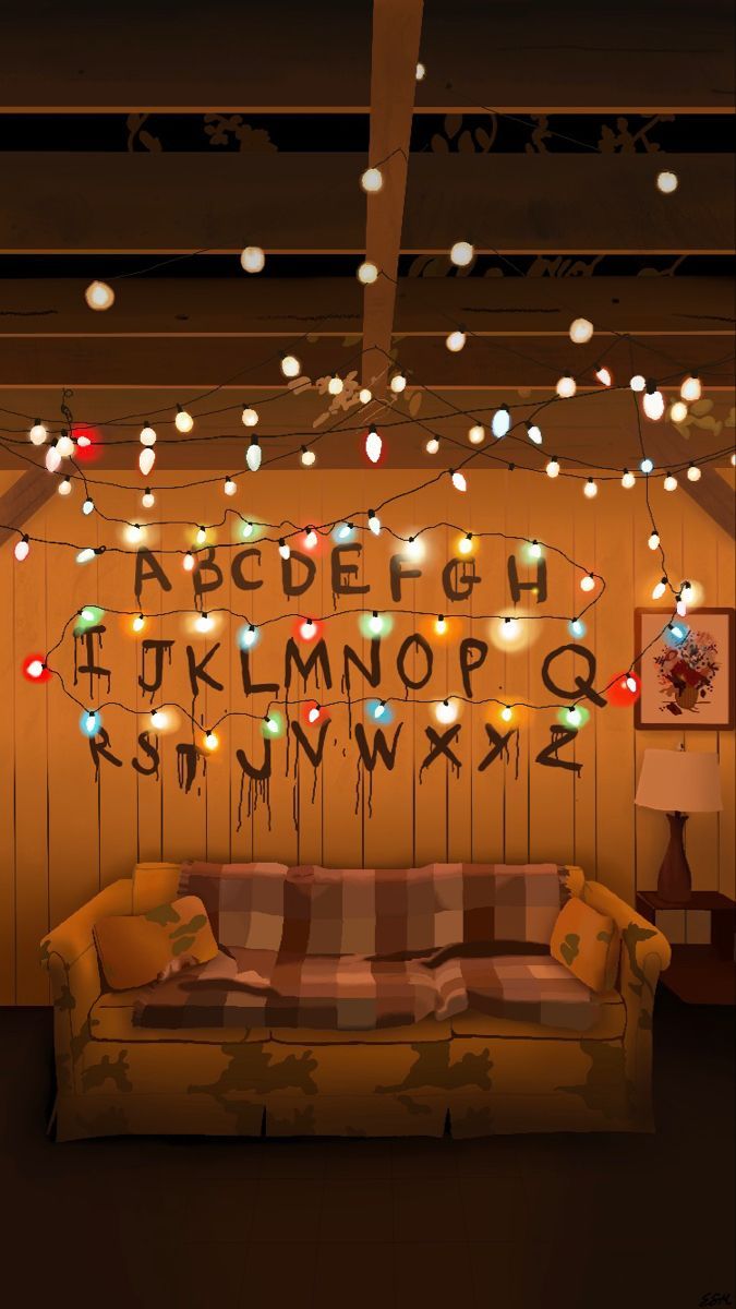 a living room filled with lots of lights and decorations on the wall next to a couch