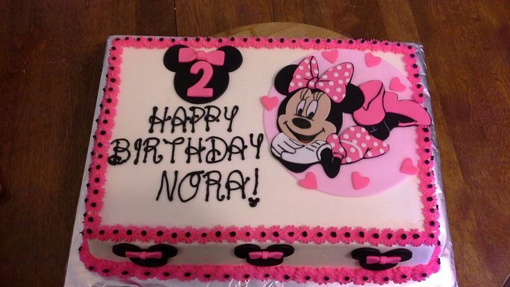 a birthday cake with minnie mouse on it