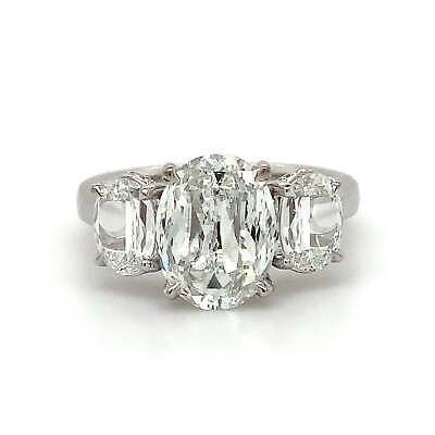 an oval and baguette diamond three stone ring