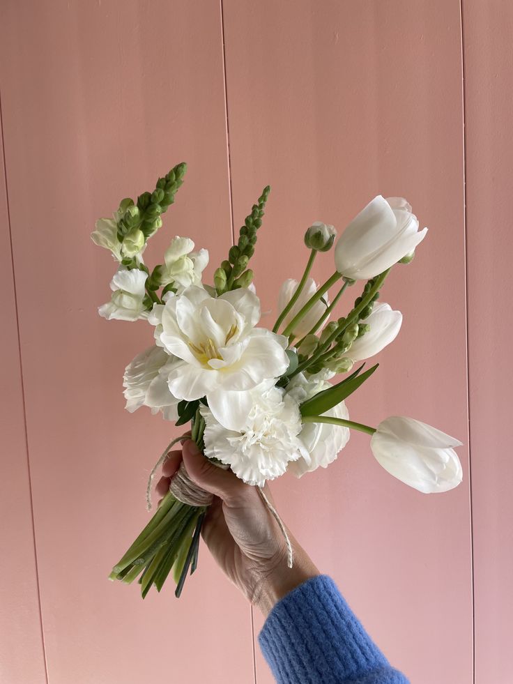 #white #bridal #bouquet #wedding #flowers #tulips #snapdragons #carnations White Tulips Bridesmaid Bouquet, Bridal Bouquet Tulips Peonies, White Carnations And Eucalyptus, Tulips In Wedding, Tulips Bridesmaid Bouquets, Ranunculus Tulip Bouquet, White Poppy Wedding Flowers, Mini Bridesmaid Bouquet White, 2025 Wedding Bouquet