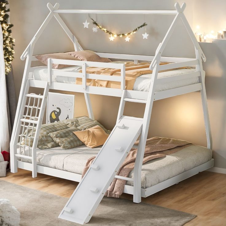 a white bunk bed with a slide on the bottom