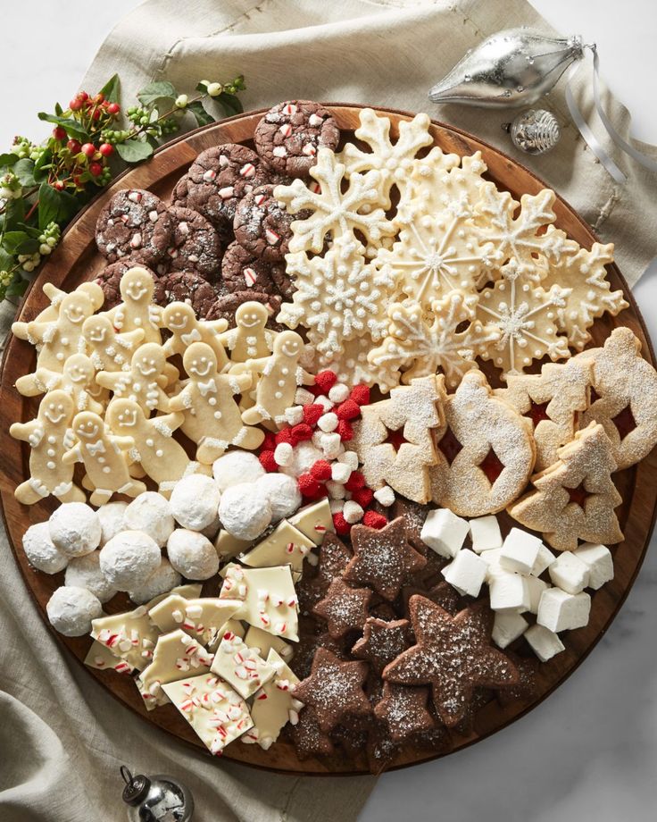 a platter filled with cookies and other holiday treats