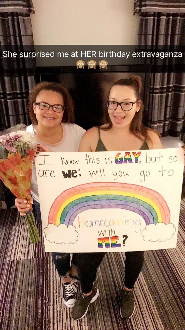 two girls holding a sign that says, i know this is gay but so are we will you go to prom?