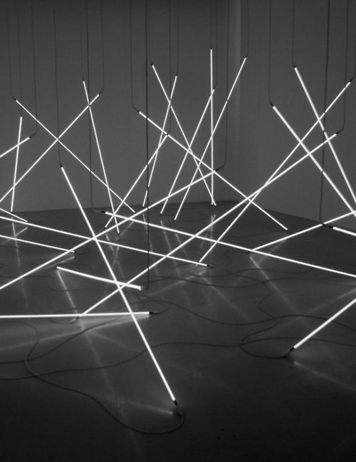 an array of sticks and wires in black and white