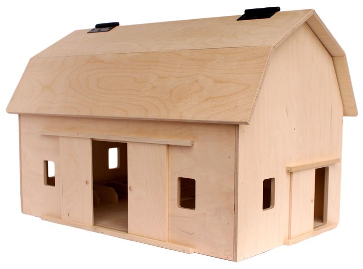 a wooden toy house with three windows