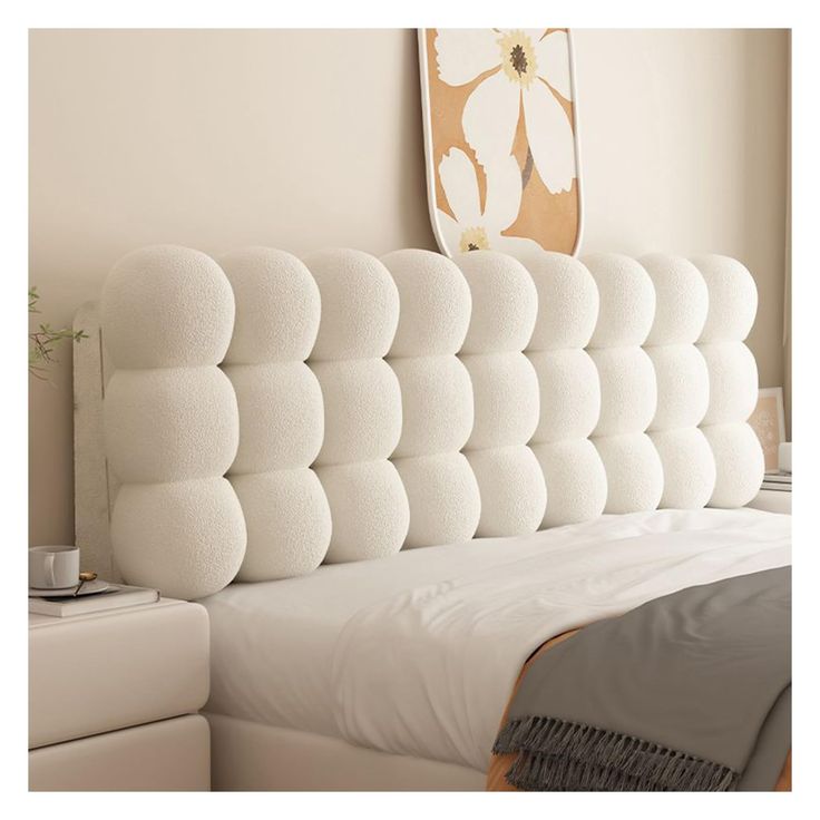 the headboard of a bed is made up to look like it has been made from foam