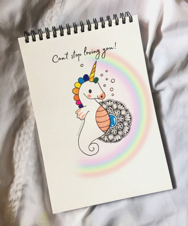 a spiral notebook with an image of a unicorn on it and the words, i can't stop loving you