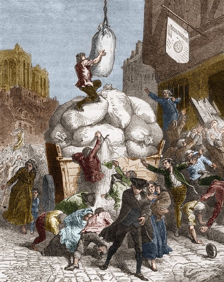 an image of a group of people in the street with bags on their heads and one person hanging from a rope