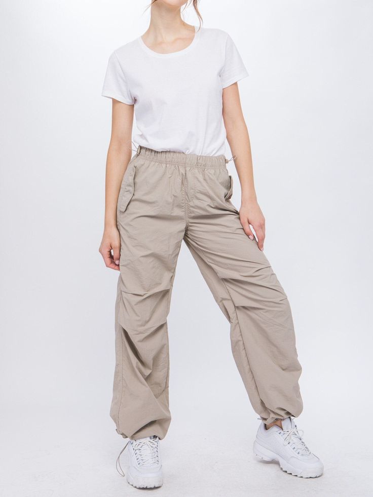 90s Style Baggy Parachute Trousers, 90s Baggy Parachute Trousers, Urban Full Length Parachute Pants For Outdoor Activities, 90s Cargo Style Wide Leg Parachute Pants, 90s Style Stretch Streetwear Pants, Loosely Fitted Full-length Parachute Pants For Outdoor, Stretch Utility Parachute Pants For Streetwear, Urban Full-length Parachute Pants With Elastic Waistband, Urban Style Full-length Parachute Pants