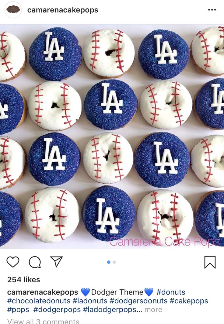 the dodgers donuts are decorated with white and blue icing