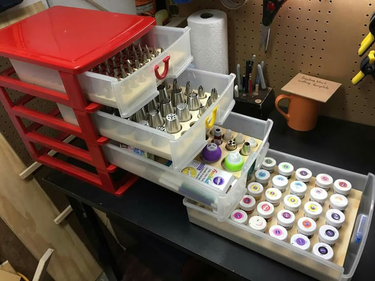 an assortment of crafting supplies sitting on a workbench with tools in it