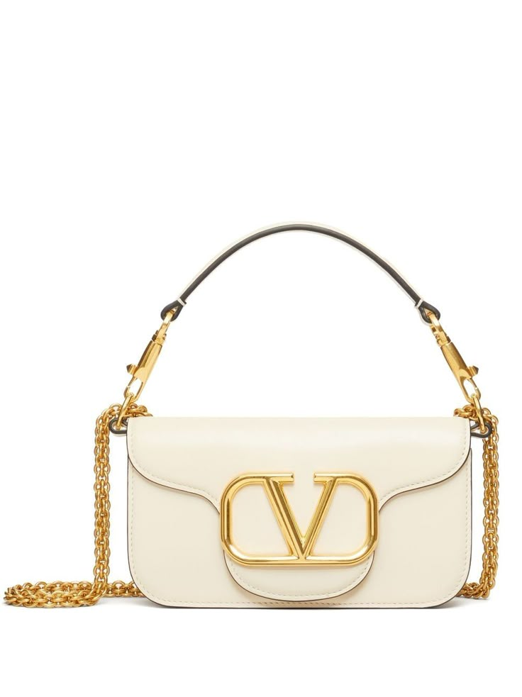 small Locò shoulder bag from VALENTINO GARAVANI featuring ivory white, leather, VLogo Signature, single detachable top handle, detachable chain-link shoulder strap, foldover top with magnetic fastening, main compartment, internal slip pocket, internal logo stamp and gold-tone hardware. Valentino Garavani Bag, Luxury Bags Collection, Bag Stand, Pretty Bags, Valentino Bags, Logo Stamp, Small Shoulder Bag, Bags Designer Fashion, Branded Bags