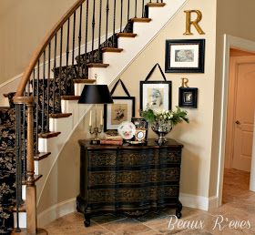 a staircase in a home with pictures on the wall