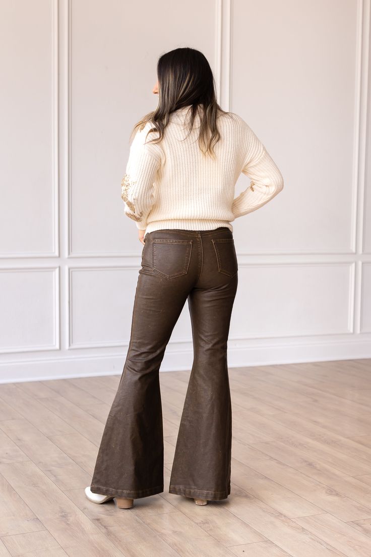 These bellbottoms are not just pants; they are a statement piece. Pair them with a flowy blouse, a tucked-in tee, or a tailored blazer – the styling possibilities are endless.Model & Fit Model: Maggie ( 5'5 and Size 6 or S) Fitted through waist and hips Stretch: No Zipper Fly Light distressing throughout for a more worn look Flare Leg High rise: 11.5" Inseam: 32" Fabric & Care Material: 100% PU Leather Care Instructions: Wash Cold, Dry Flat Manufactured overseas Wide Leg Brown Flare Jeans For Work, Chic Brown Wide Leg Flare Jeans, Casual Wide Leg Flares For Fall, Elegant Wide-leg Flare Jeans For Spring, Fall Flare Jeans For Night Out, Trendy Fall Flare Jeans With Flared Hem, Casual Fitted Wide Leg Pants For Fall, Trendy Wide Leg Flare Jeans For Fall, Non-stretch Flared Hem Bottoms For Fall