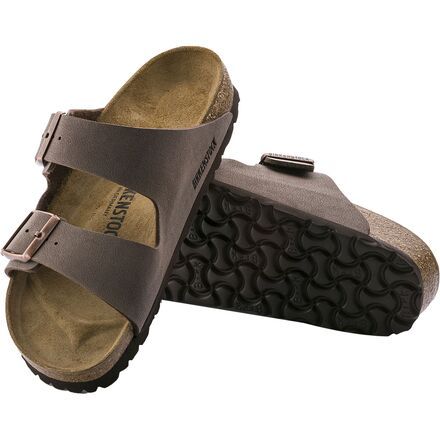 After a long morning hike, nothing feels better than to get back to camp, take off your heavy hiking boots, and slip on the Birkenstock Men's Arizona Sandal. Better than going barefoot, this sandal's contoured cork footbed conforms to the shape of your foot while protecting your foot from rocks and thorns as you walk from your tent to the lake for a late lunch overlooking the water. The durable synthetic straps are finished with a leather-like texture for classic style, while the buckled design Brown Slides With Arch Support For Outdoor, Brown Outdoor Slides With Arch Support, Leather Sandals With Cork-bed Midsoles For Outdoor Activities, Rugged Slip-on Outdoor Sandals, Casual Leather Slides For Outdoor Activities, Rugged Outdoor Slip-on Sandals, Brown Slides With Rubber Sole For Outdoor, Brown Outdoor Slides With Rubber Sole, Leather Slip-on Slides For Outdoor