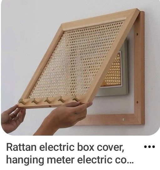 someone is holding an electric box cover in front of a wall mounted heater with the words rattan electric box cover, hanging meter electric co