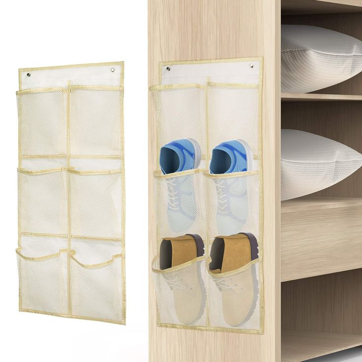 a pair of white shoes hanging on a wooden shelf