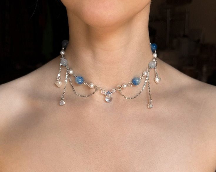 This handmade beaded Blue Fairy Necklace is made with glass, acrylic, and resin beads, with stainless steel chains.  ✧ Size: 12 inches with a 2-inch extender (adjustable to 14 inches). Perfect for those with a petite neck. If you need a larger or smaller size, message me with your desired measurements! I can add more beads and/or a second extender.  ✧ Closure: Lobster claw ✧ Care: For longevity, please keep away from water and perfumes. If you have any questions, feel free to reach out ♡ For more, visit my shop: https://www.etsy.com/shop/stardropstop Fairy Beaded Necklace, Necklace Reference, Coquette Necklace, Necklace Fairycore, Cottagecore Jewelry, Reference Ideas, Necklace Inspiration, Diy Necklaces, Y2k Necklace