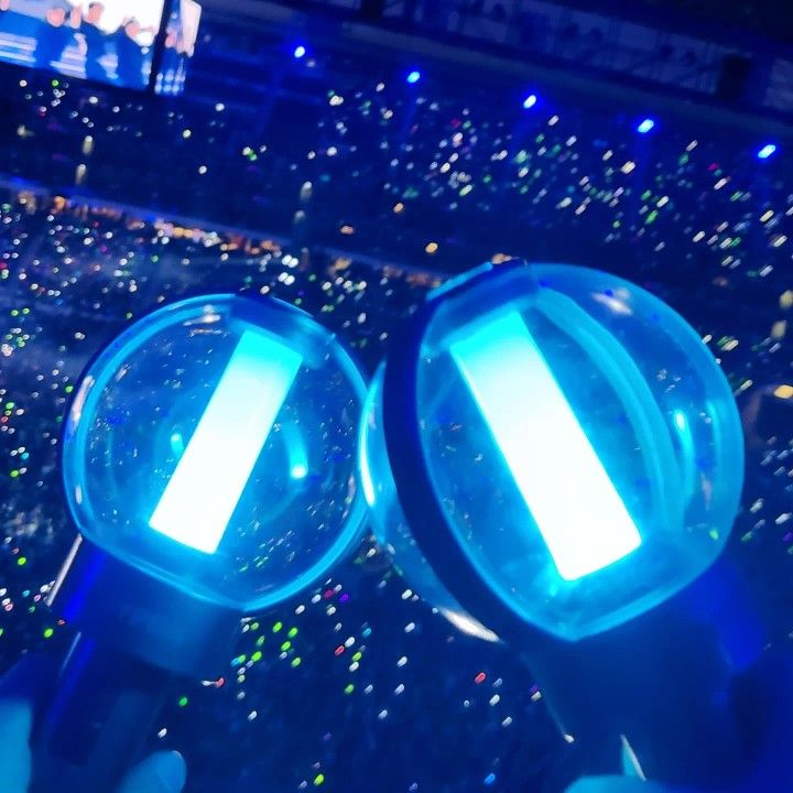 two magnifying glasses sitting on top of each other in front of a crowd