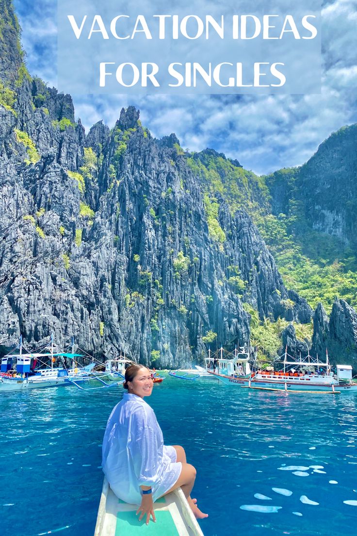 a woman sitting on top of a boat in the ocean with text overlay that reads vacation ideas for singles