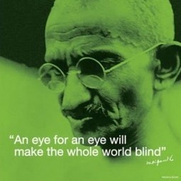 an old man with glasses and a quote on the side of his face that says, an eye for an eye will make the whole world blind