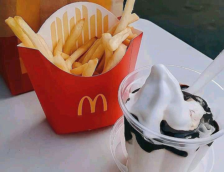 french fries and milkshake are sitting on a table