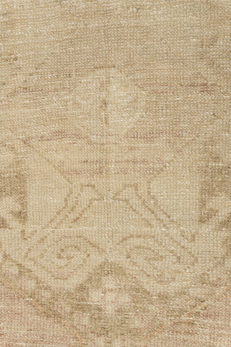 an old rug is shown with faded colors