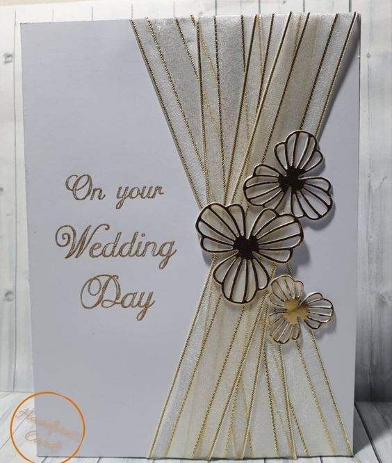 a wedding card with flowers on it