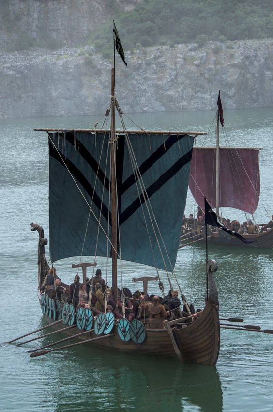 several boats with people on them in the water