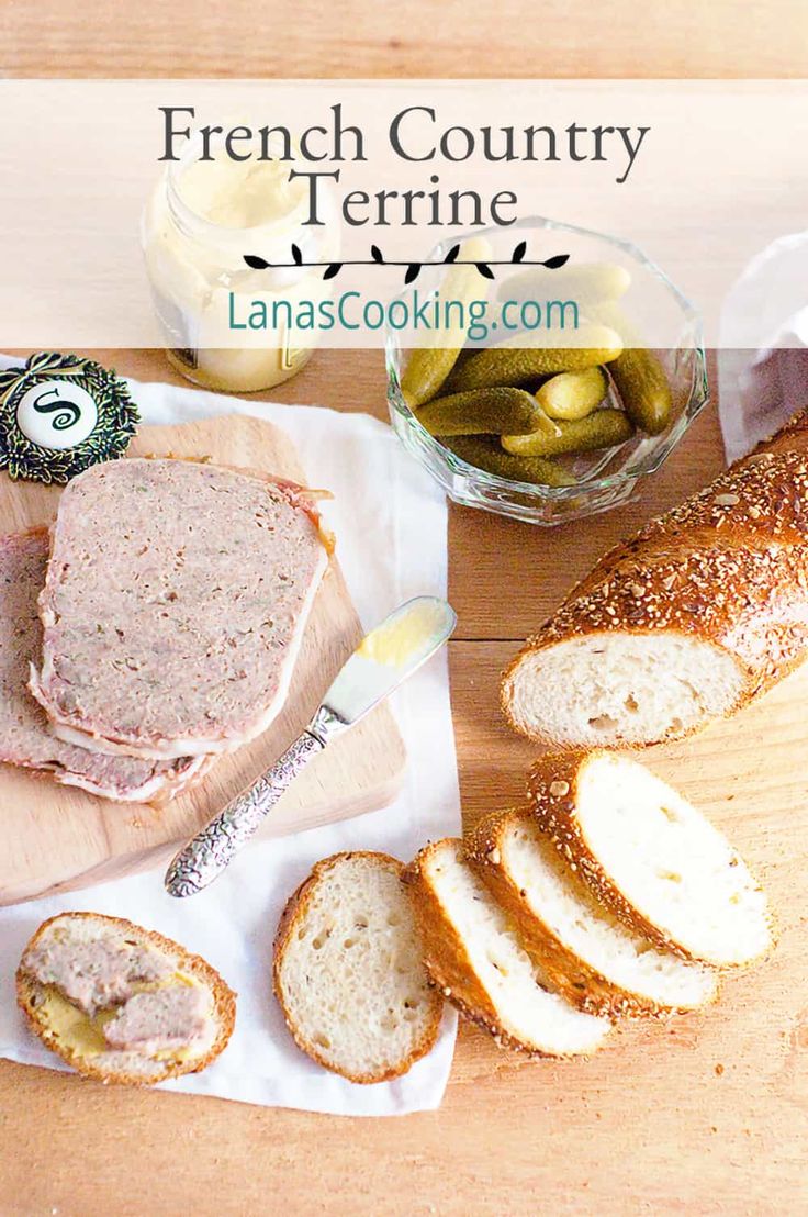 bread, meat and olives on a cutting board with the words french country terrier