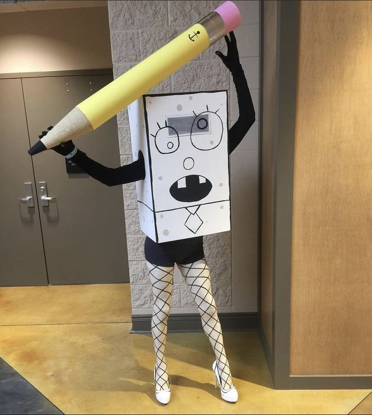 a person dressed as a cartoon character holding a giant pencil