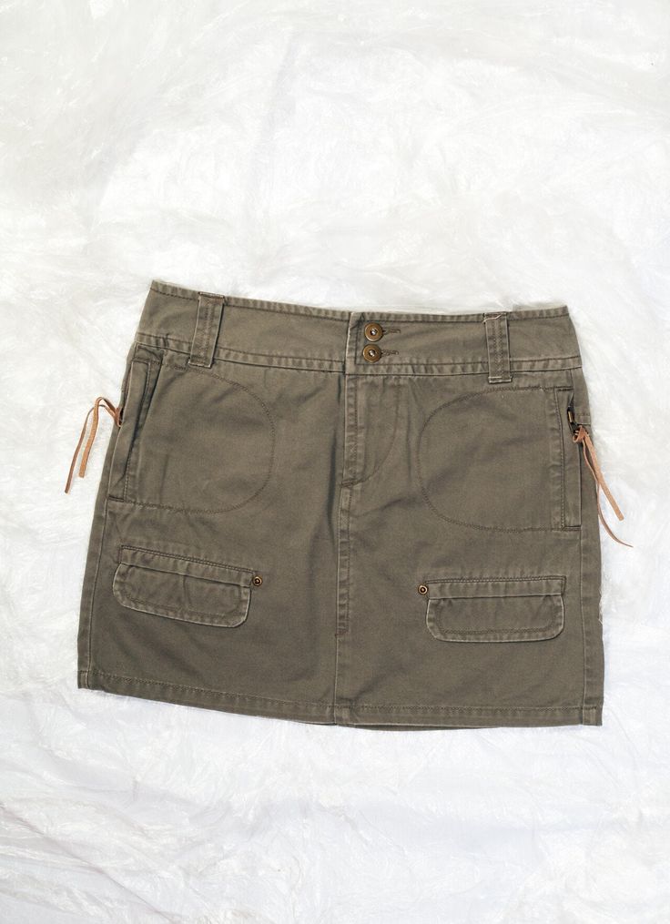 This Y2K vintage cargo skirt is the kind of throwback that makes you say "khaki is the new black". Recommended size: EU 36-38. Features: - four pockets - zip closure - 100% cotton Every item we manage is cleaned and, when necessary, repaired, ensuring it arrives to you in top condition. Size: M / US 6 / UK 10 / IT 42 Other size info: Labelled size: 42 Measurements:  waist (seam to seam): 40 cm / 15.6" length: 40 cm / 15.6" Fabric: cotton 100% Care: Machine wash inside out Cotton Mini Skirt, Cargo Skirt, Vintage Skirt, Label Sizes, Y2k Vintage, Hungary, New Black, Vintage Y2k, Favorite Outfit